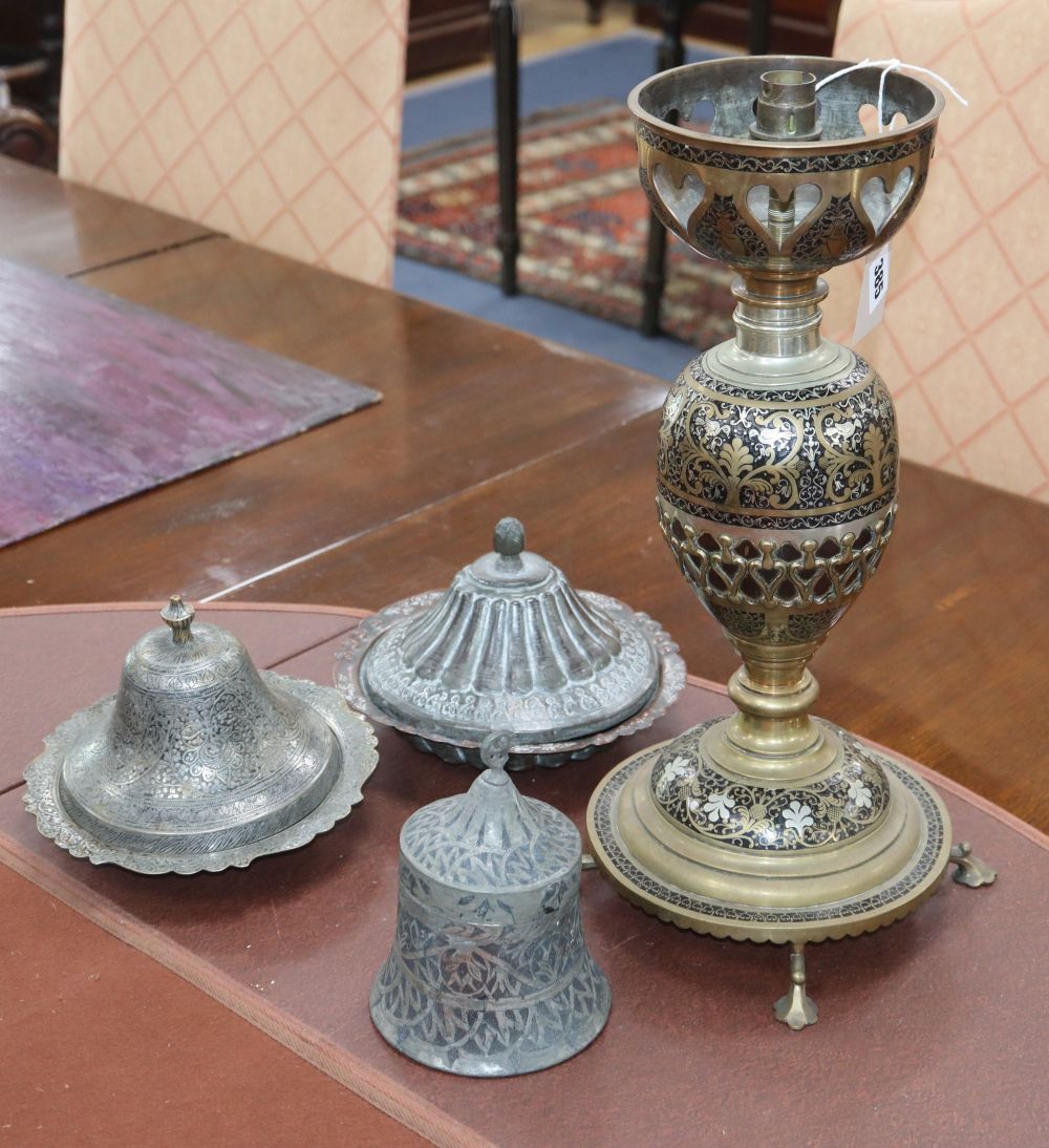 Three Indo-Persian tinned lidded dishes and a brass huqqa base table lamp, largest 43.5cm